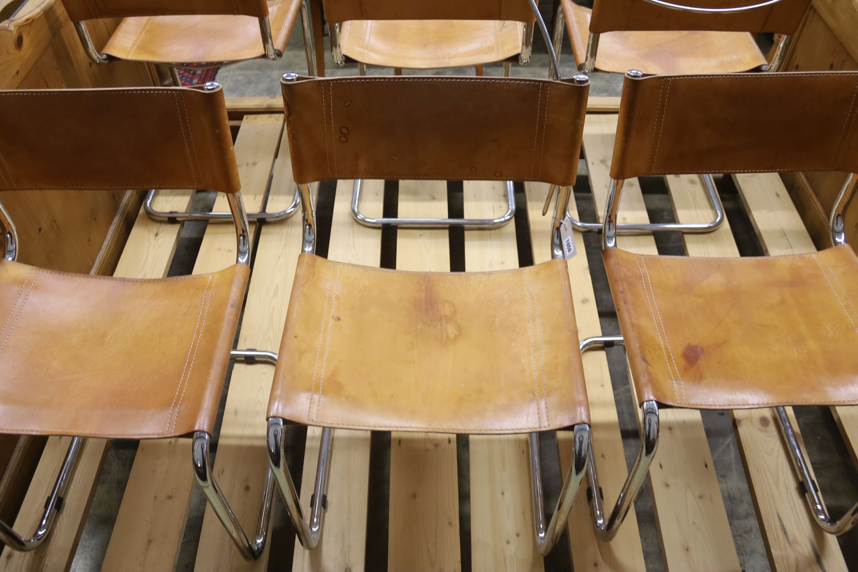 A set of six Italian design tan leather and chrome cantilever dining chairs, width 48cm, depth 44cm, height 77cm